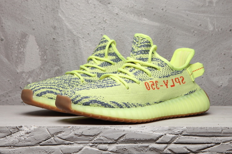 Lime Green and Brown Yeezy Boost 350 V2 Sneakers - product image from the listing.