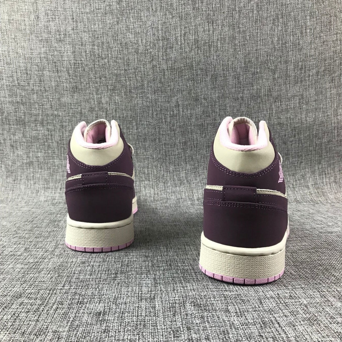 Air Jordan 1 Mid GS Sneakers in White Purple Pink - product image from the listing.