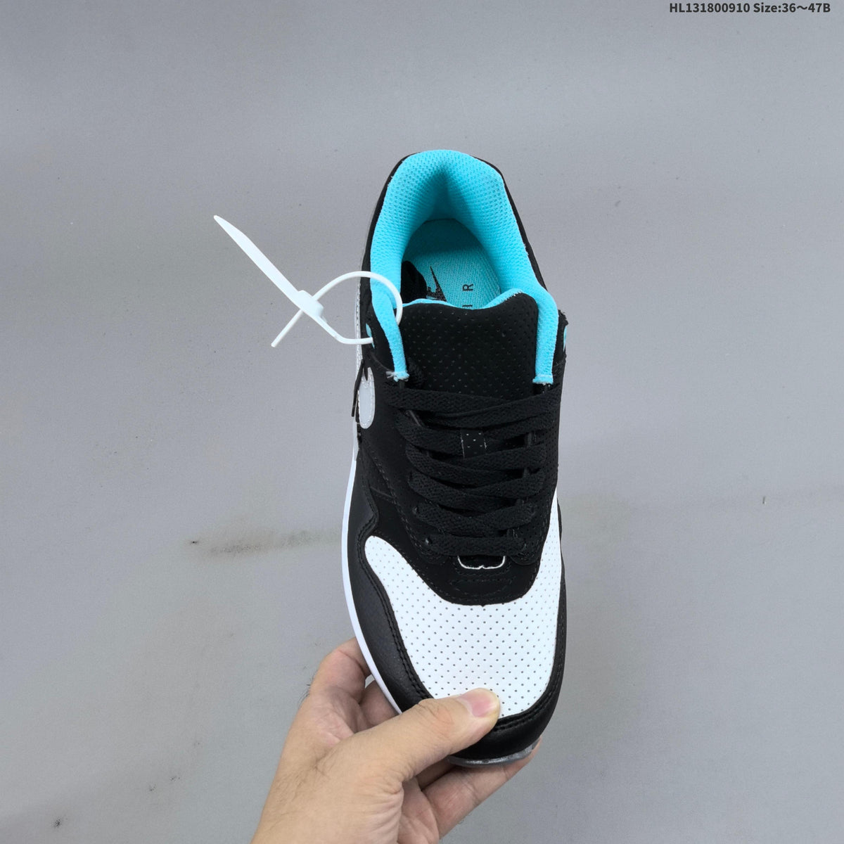 Nike Air Max 1 Sneakers in Black White and Turquoise - product image from the listing.