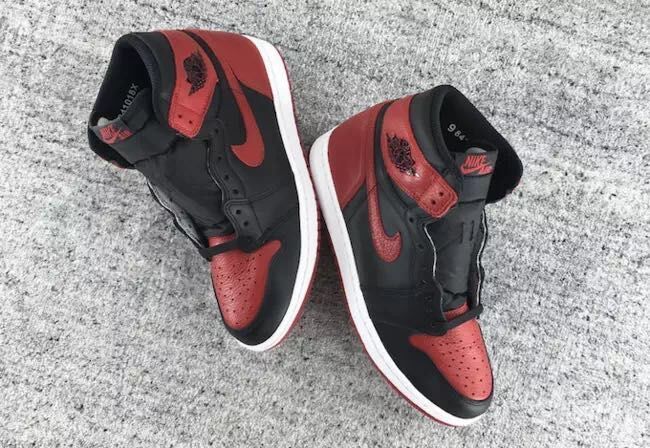 Air Jordan 1 High Sneakers in Black and Red - product image from the listing.