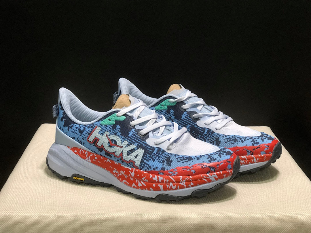HOKA Speedgoat 6 Trail Running Shoes, in Blue and Orange - product image from the listing.