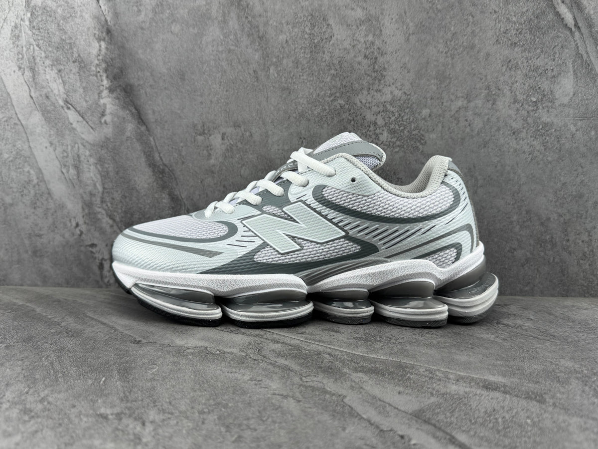 New Balance 1906R Sneakers in White and Silver - product image from the listing.