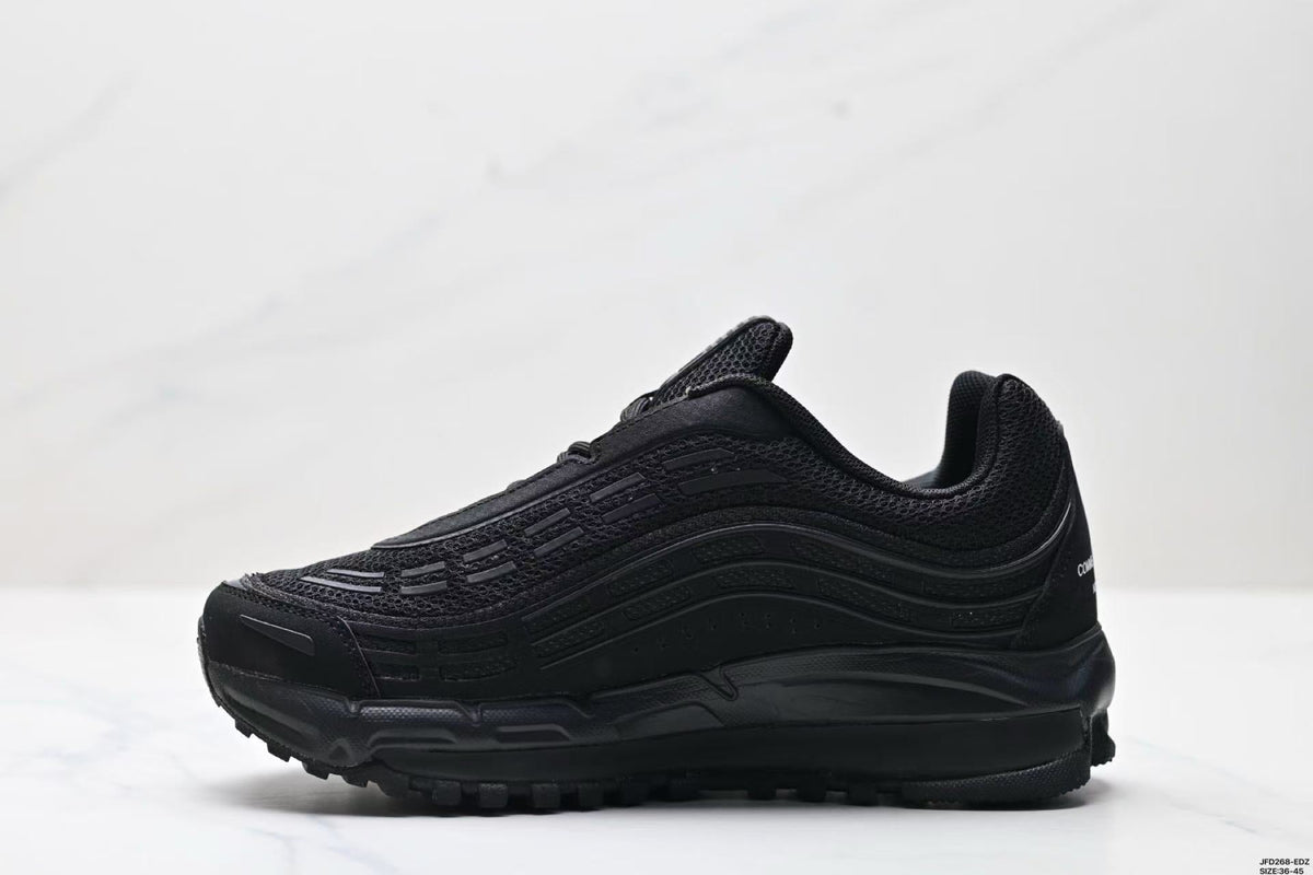 Nike Air Max Plus x Comme des Garçons Sneakers in Black - product image from the listing.