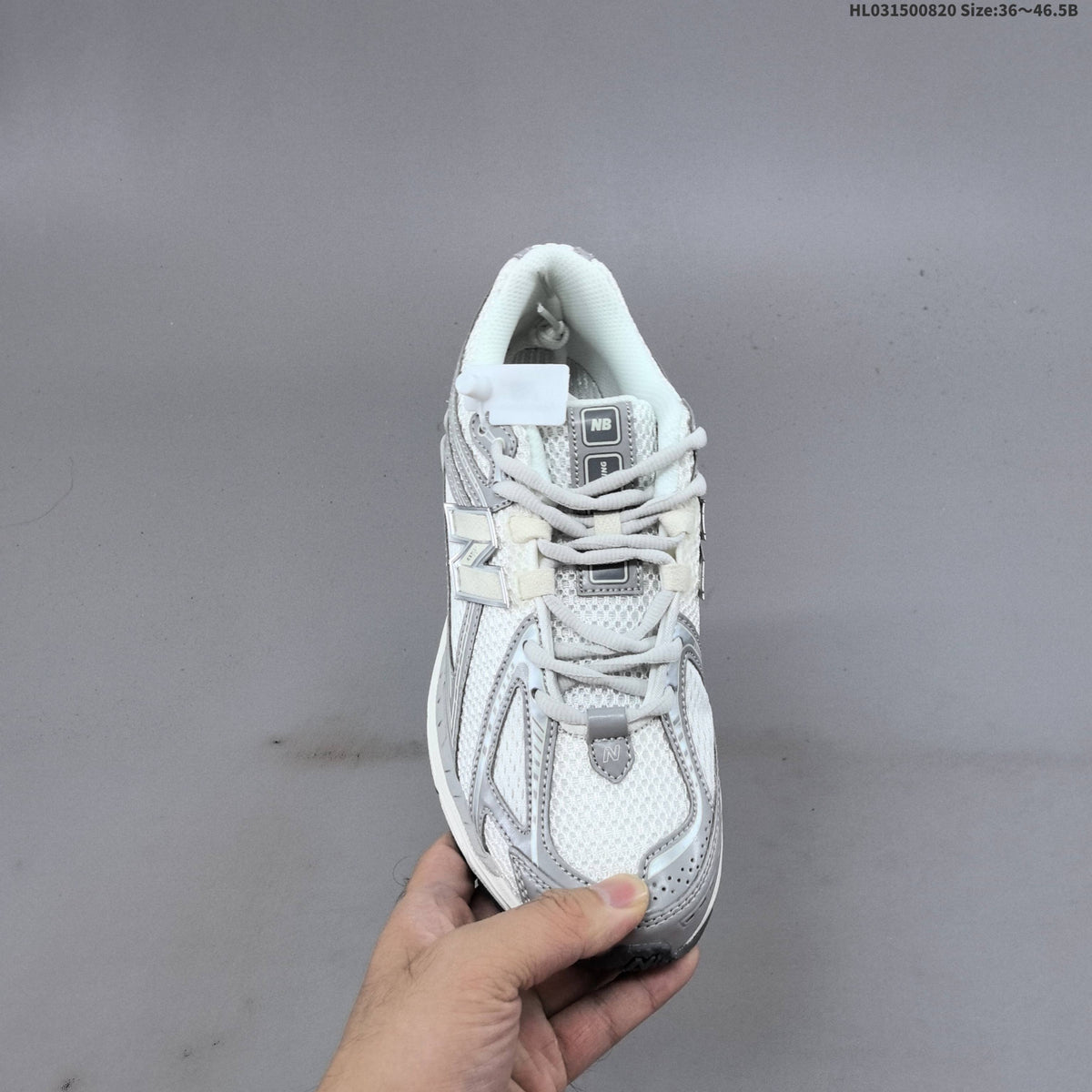 New Balance 1906R Sneakers in White Silver U1906RJM - product image from the listing.