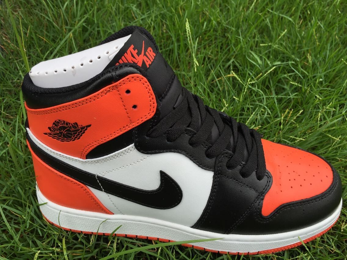 Women's Jordan 1 High Black Orange White Sneakers - product image from the listing.