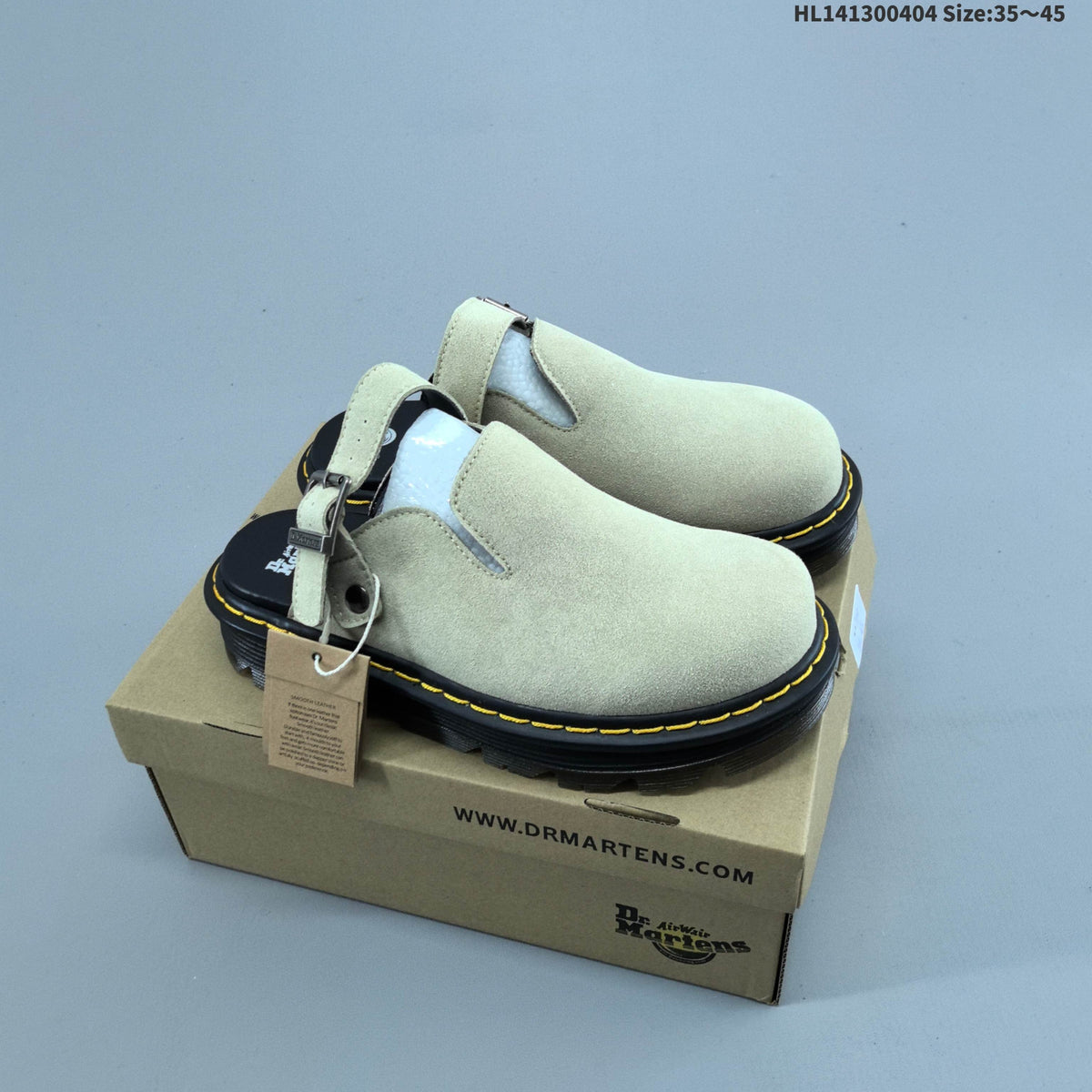 Buckle-Strap Mule Clogs in Black and Sage by Dr. Martens - product image from the listing.