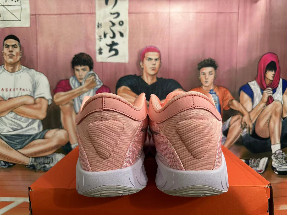 Pink and White Nike Basketball Shoes - product image from the listing.