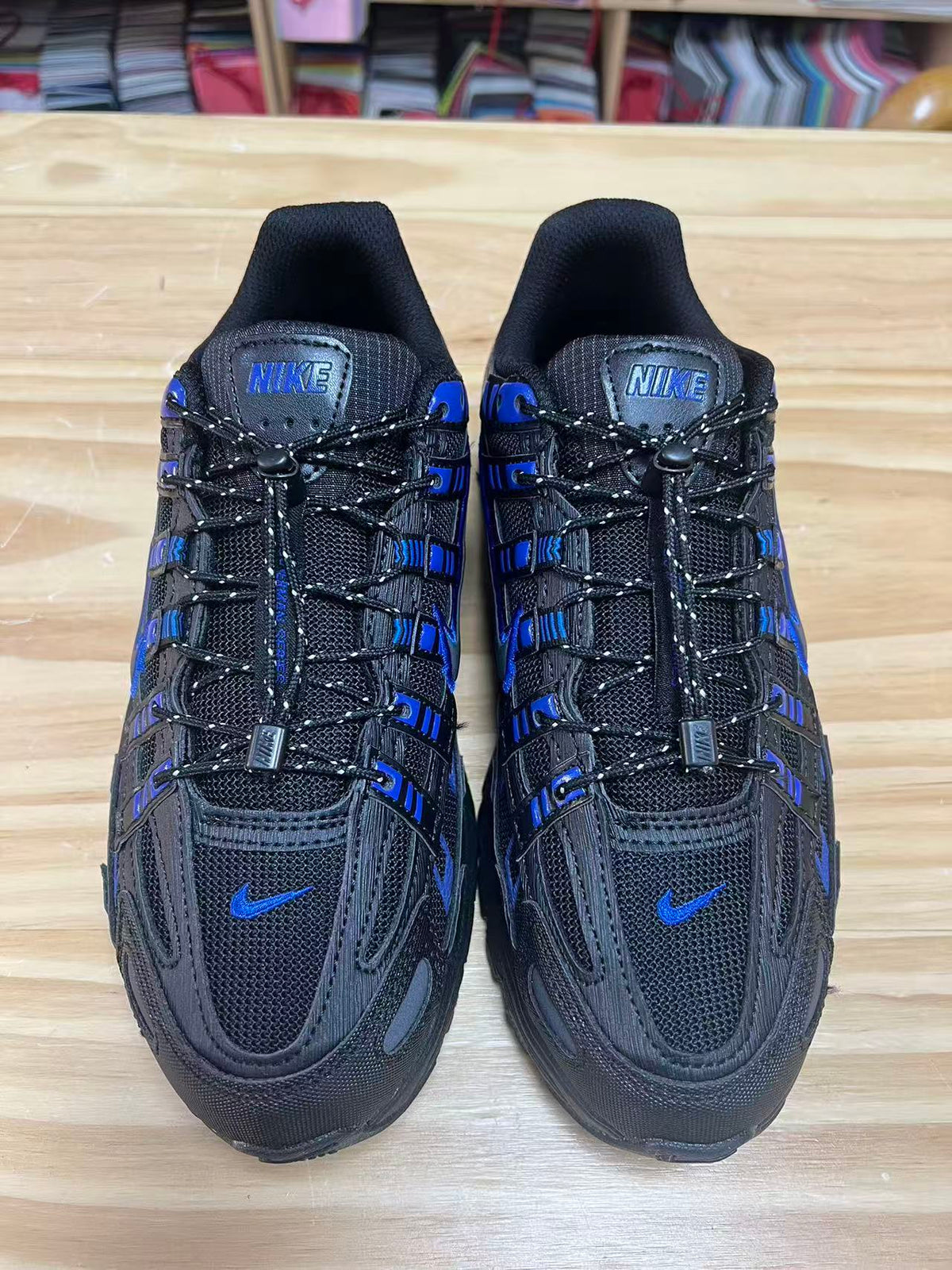Nike P-6000 Sneakers in Black Blue IO1904-010 - product image from the listing.