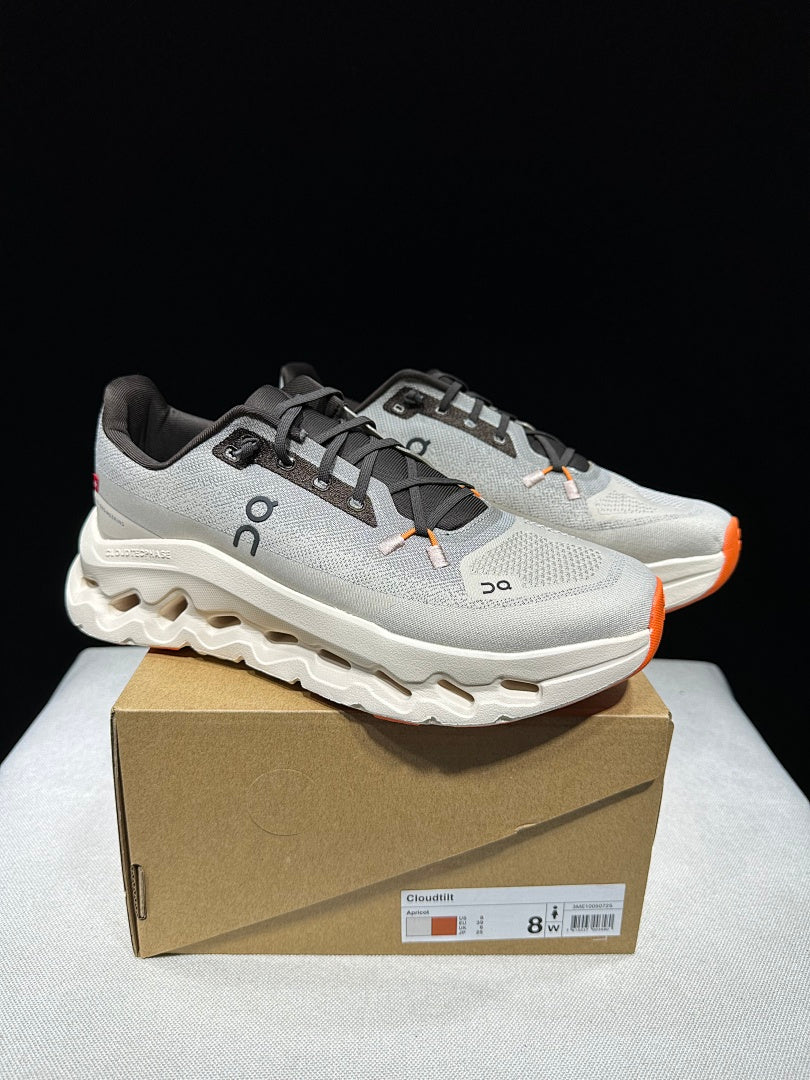 On Cloudtilt Trainers in Gray and Apricot - product image from the listing.