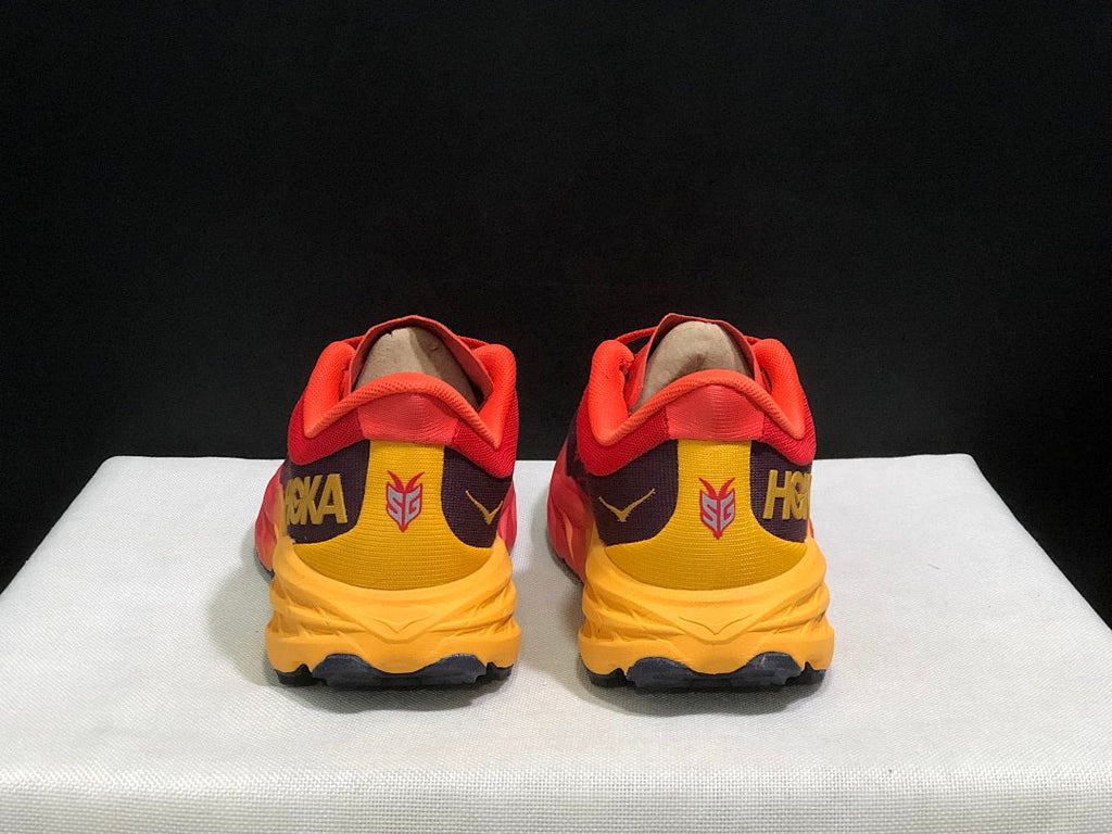 HOKA Speedgoat 5 Trail Running Shoes in Red and Yellow - product image from the listing.