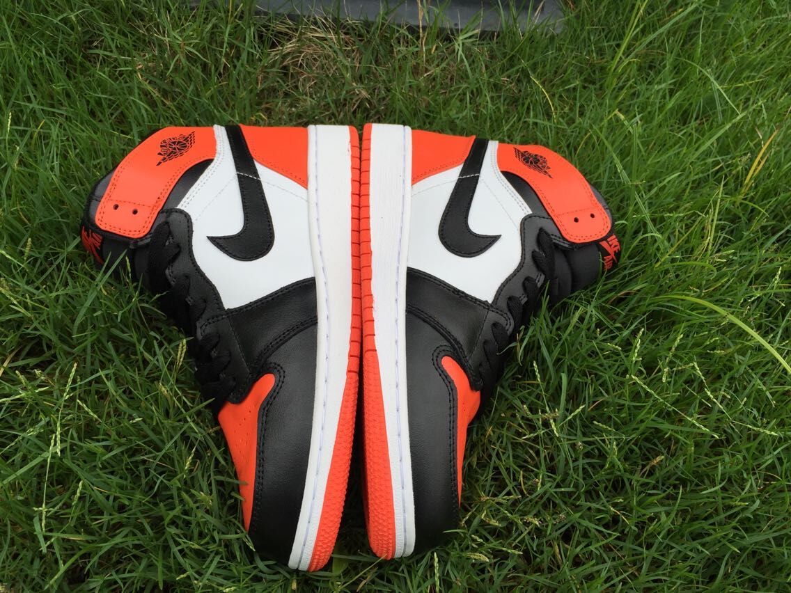Women's Jordan 1 High Black Orange White Sneakers - product image from the listing.