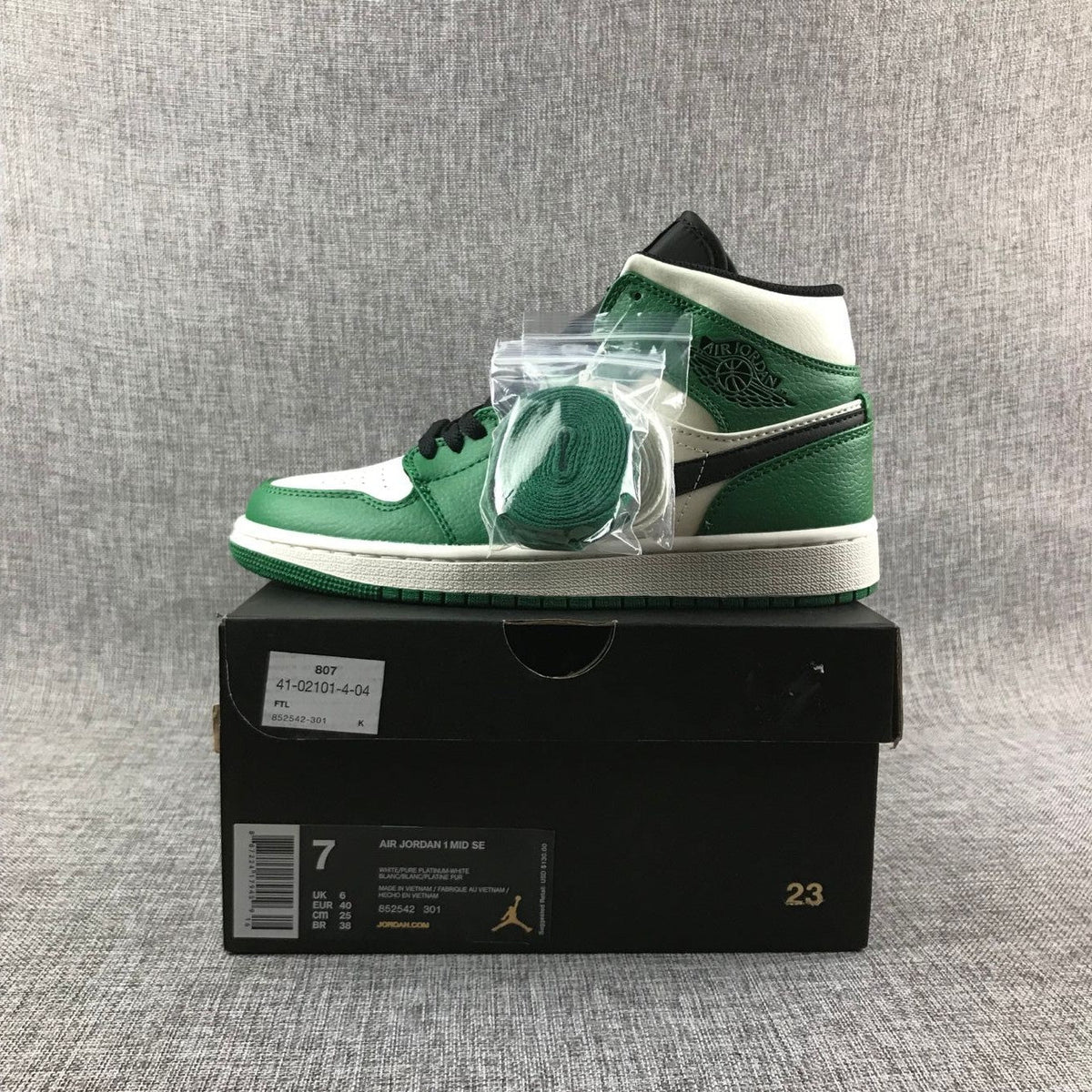 Air Jordan 1 Mid SE Sneakers in White Green Black - product image from the listing.