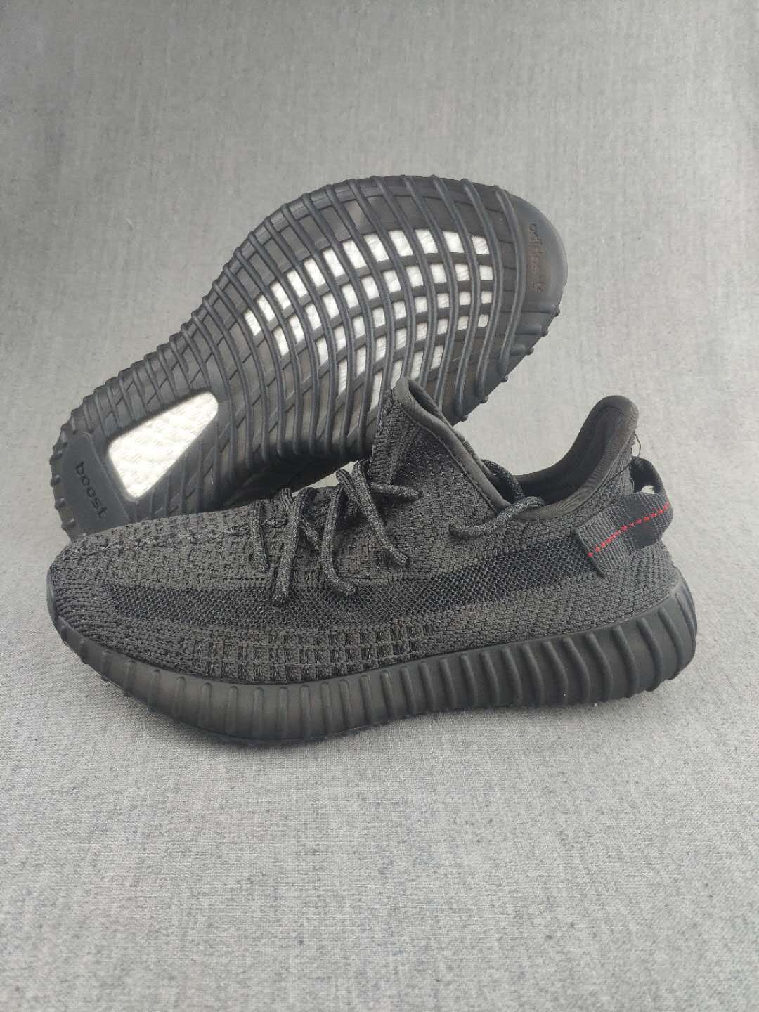 Yeezy Boost 350 V2 Sneakers in Dark Gray Knit - product image from the listing.