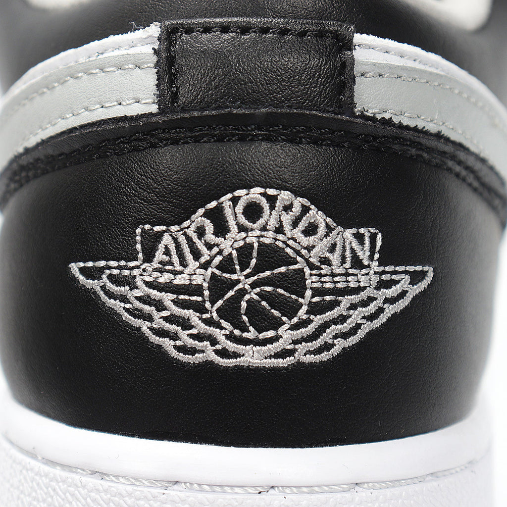 Jordan 1 Low Sneakers in Cool Grey 553560-039 - product image from the listing.
