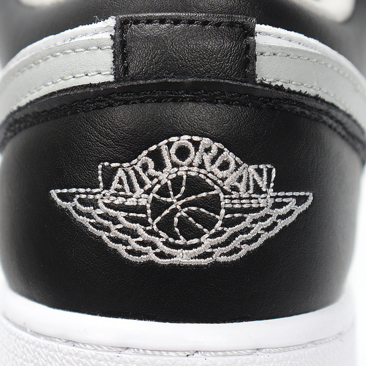 Jordan 1 Low Sneakers in Cool Grey 553560-039 - product image from the listing.