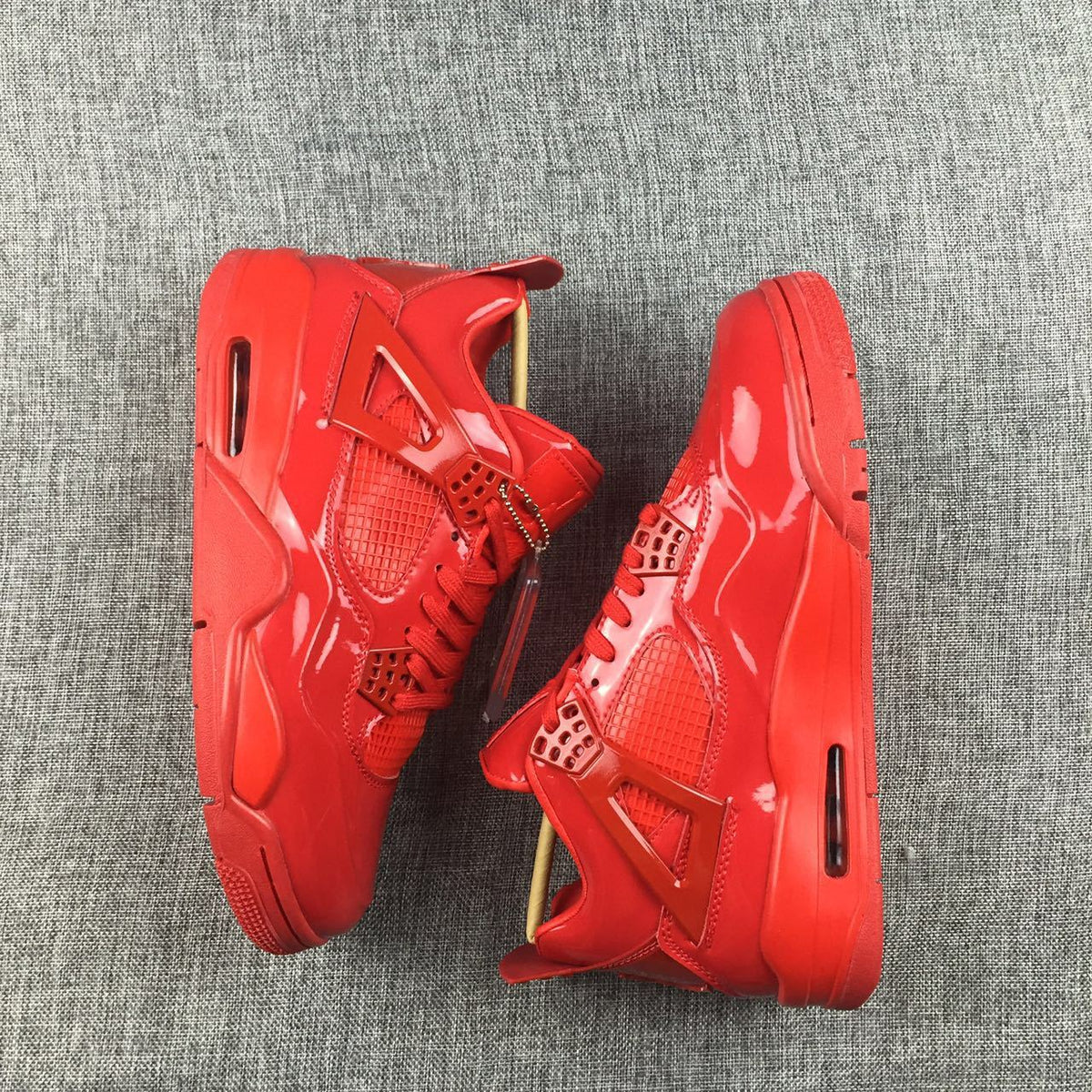 Air Jordan 4 Red Patent Leather Sneakers - product image from the listing.