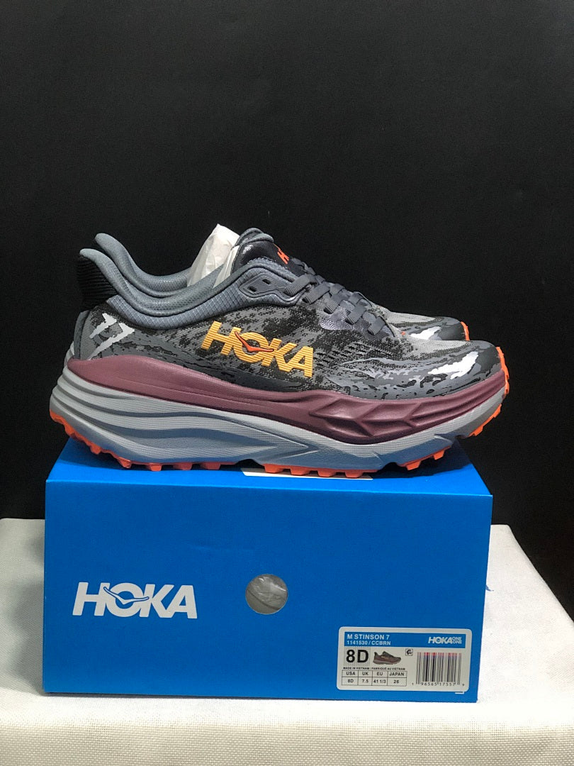 HOKA Stinson 7 Trail Running Shoes in Gray Orange - product image from the listing.