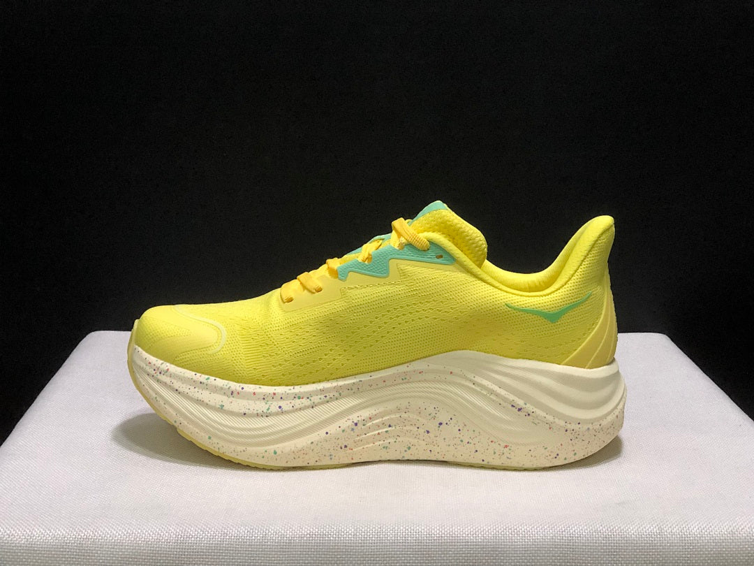 Yellow and Aqua HOKA Skyward X Running Shoes - product image from the listing.