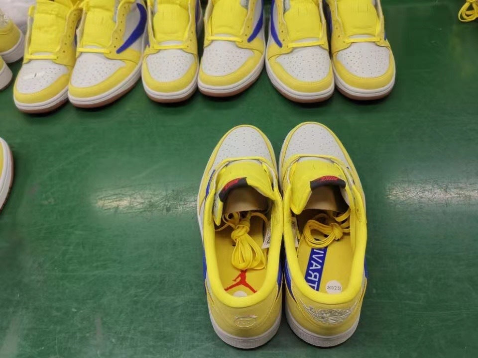 Jordan 1 Low Sneakers in Canary Yellow and Blue DZ4137-700 - product image from the listing.
