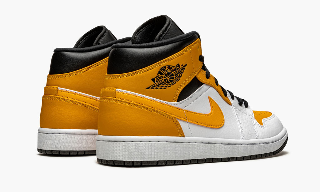 Jordan 1 Mid in University Gold - product image from the listing.