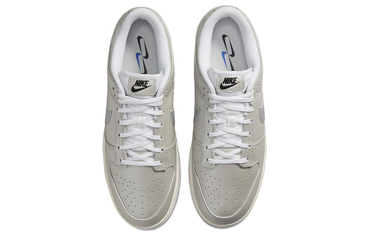 Nike Dunk Low in Metallic Silver - product image from the listing.